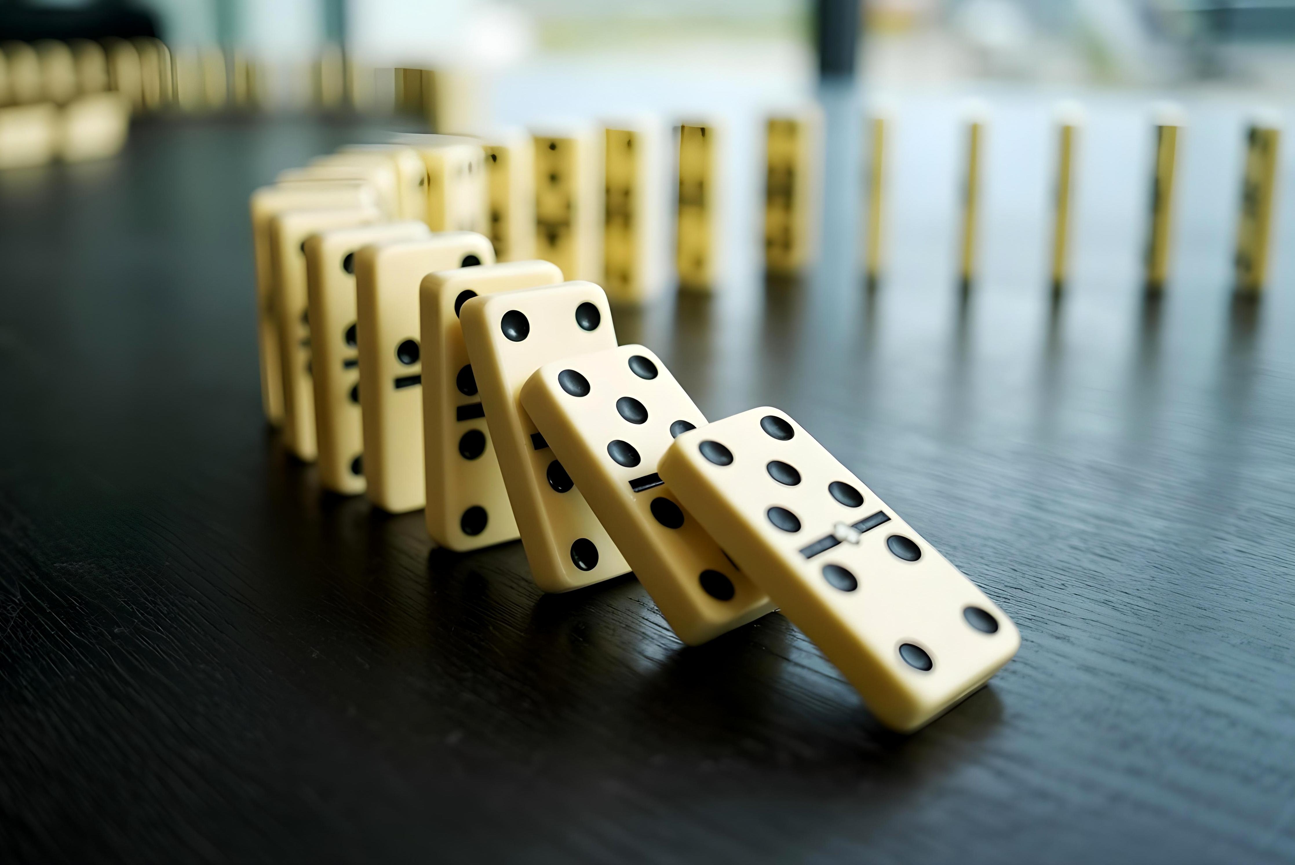 A line of dominos falling